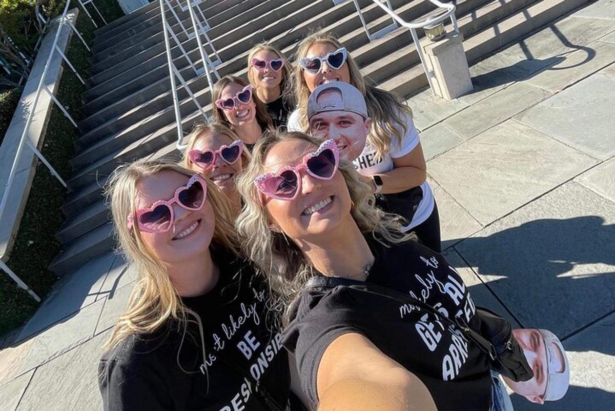 a group of girls wearing sunglasses posing for a picture