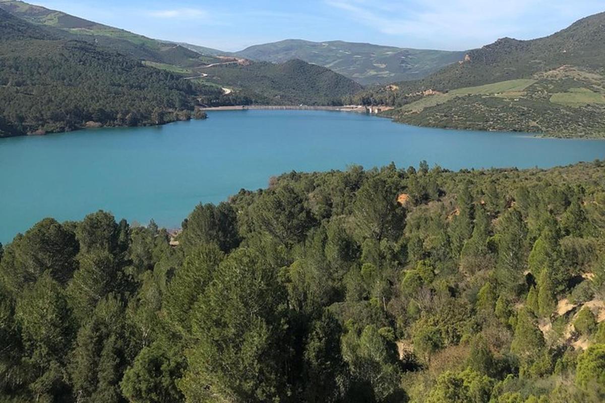 an aerial view of a lake in the hills