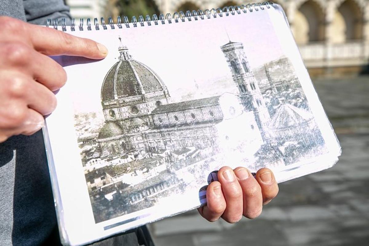 a person holding a drawing of a building