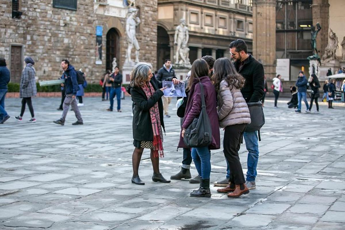 a group of people standing around in a plaza