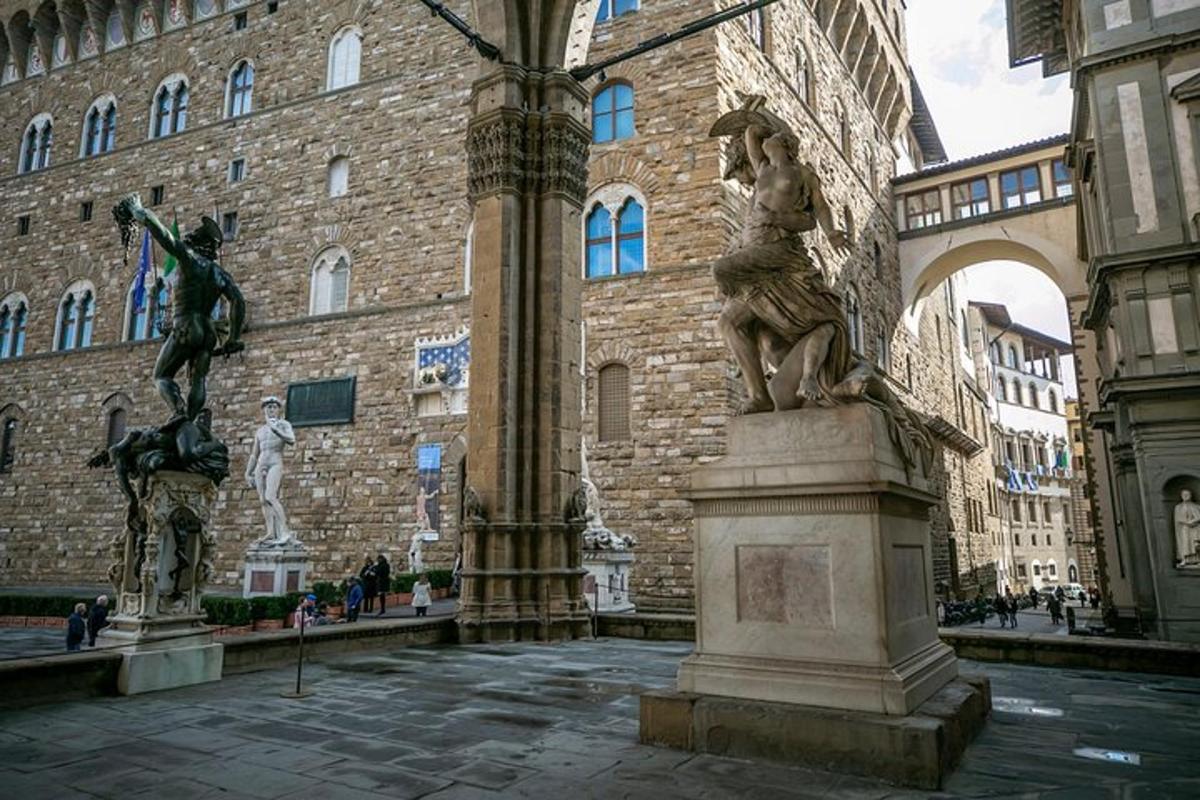 a statue in front of a large building