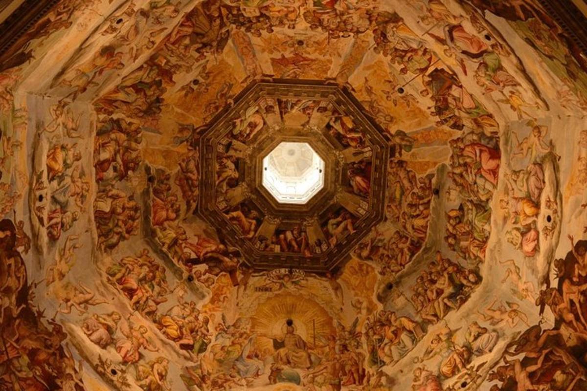 a ceiling of a church with a painting on it