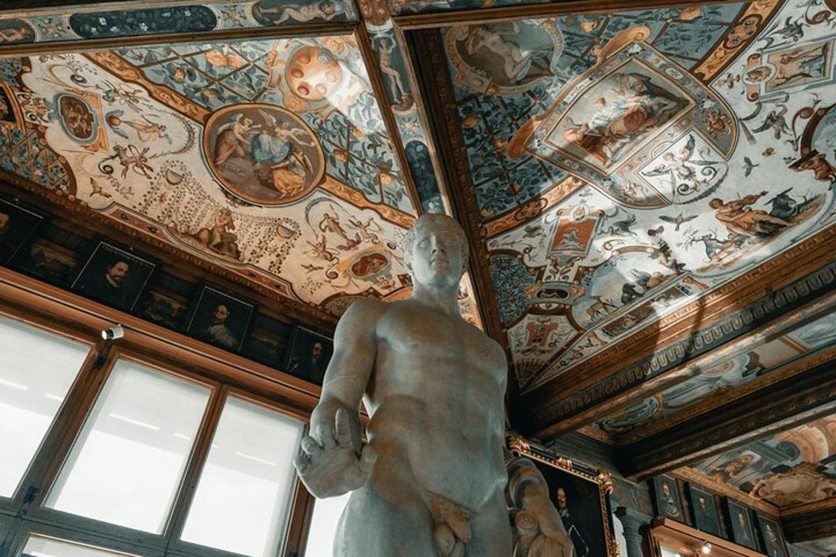 a statue in a room with paintings on the ceiling
