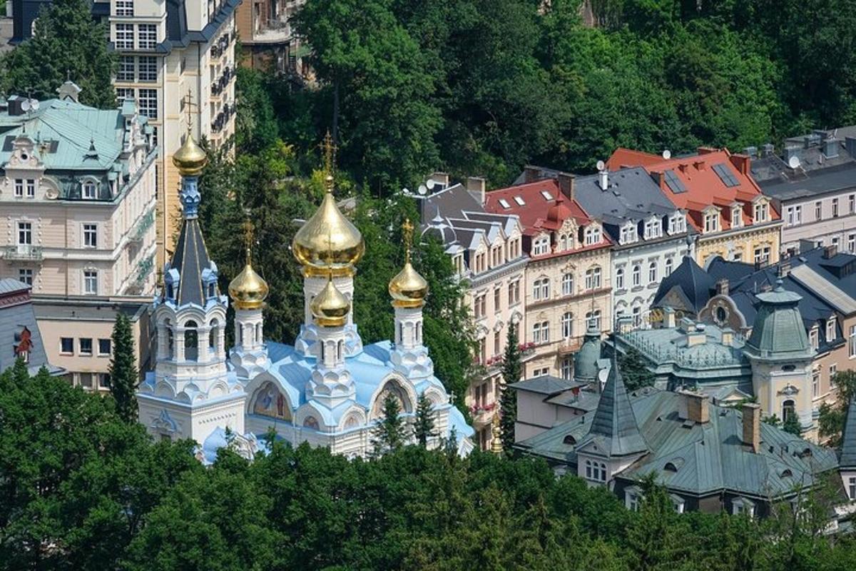 a group of buildings with gold domes and mosques
