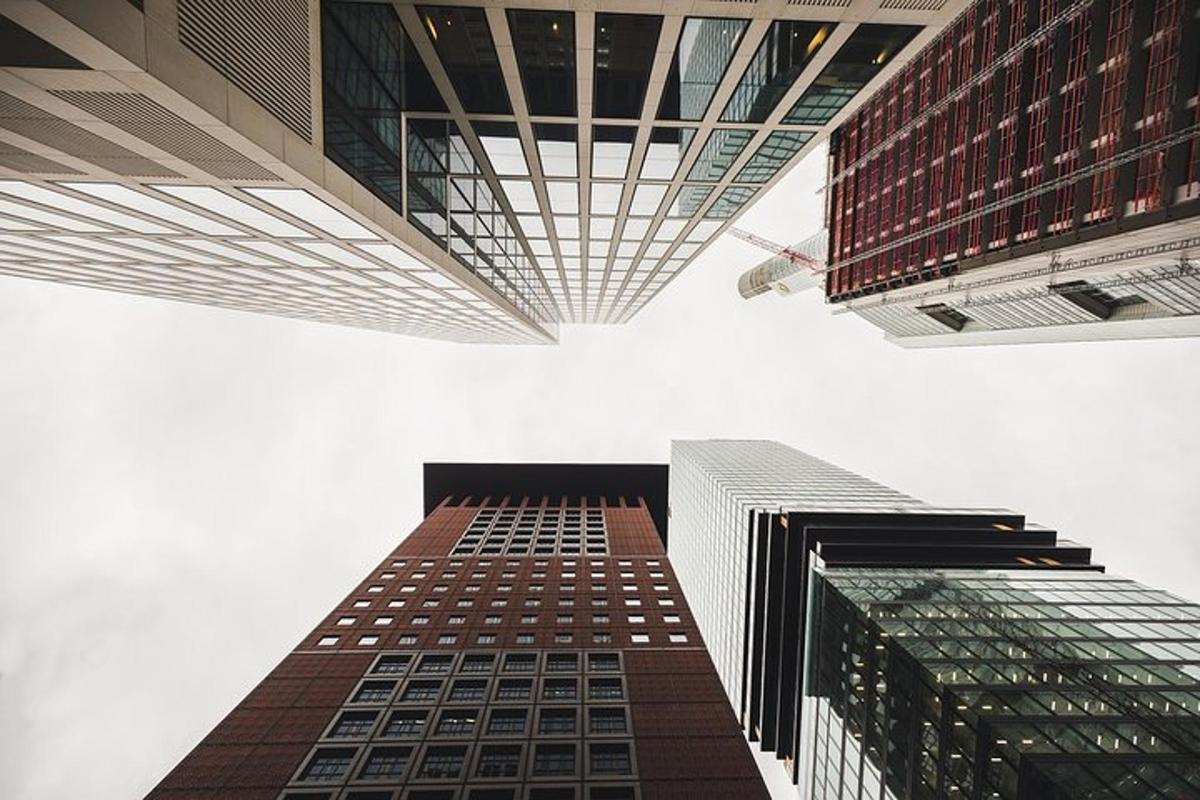 two tall buildings are looking up into the sky