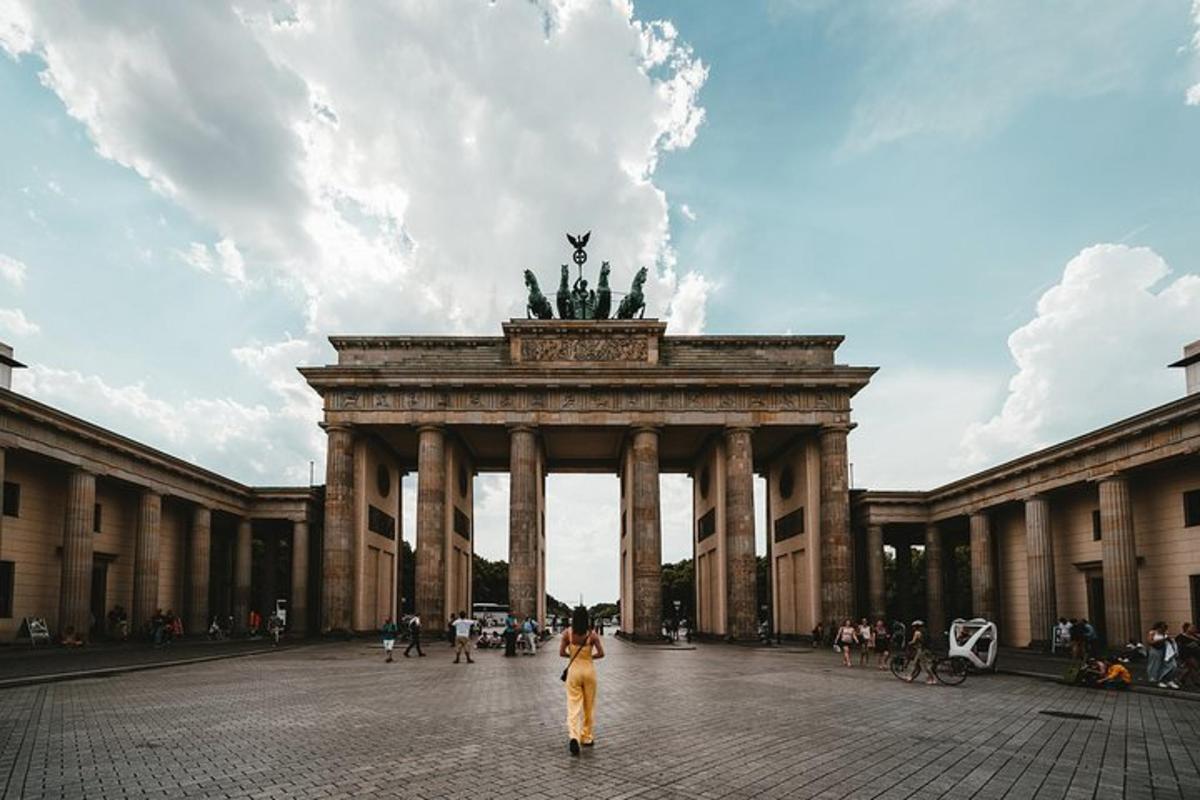a woman standing in front of a large building
