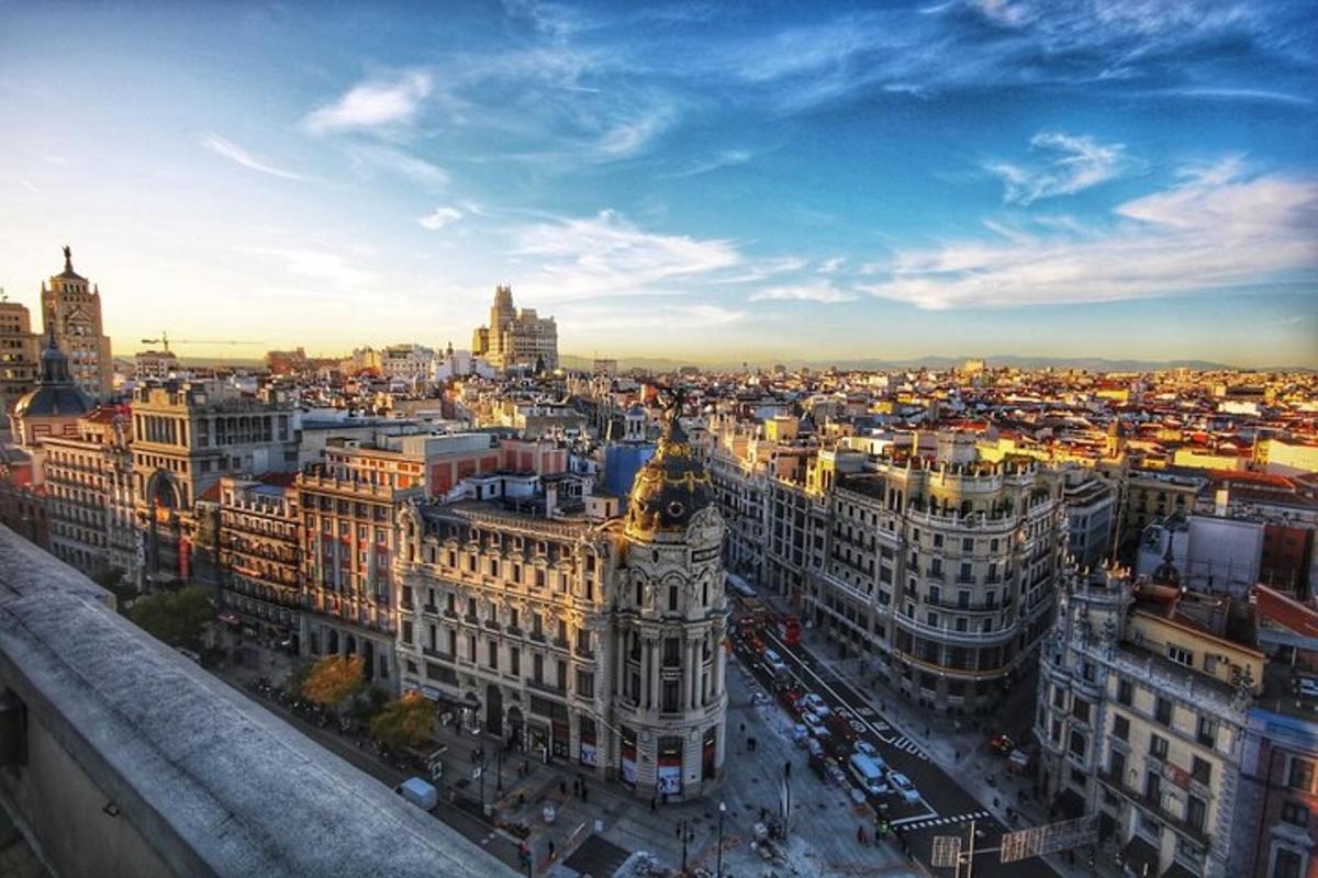 an aerial view of a city at sunset