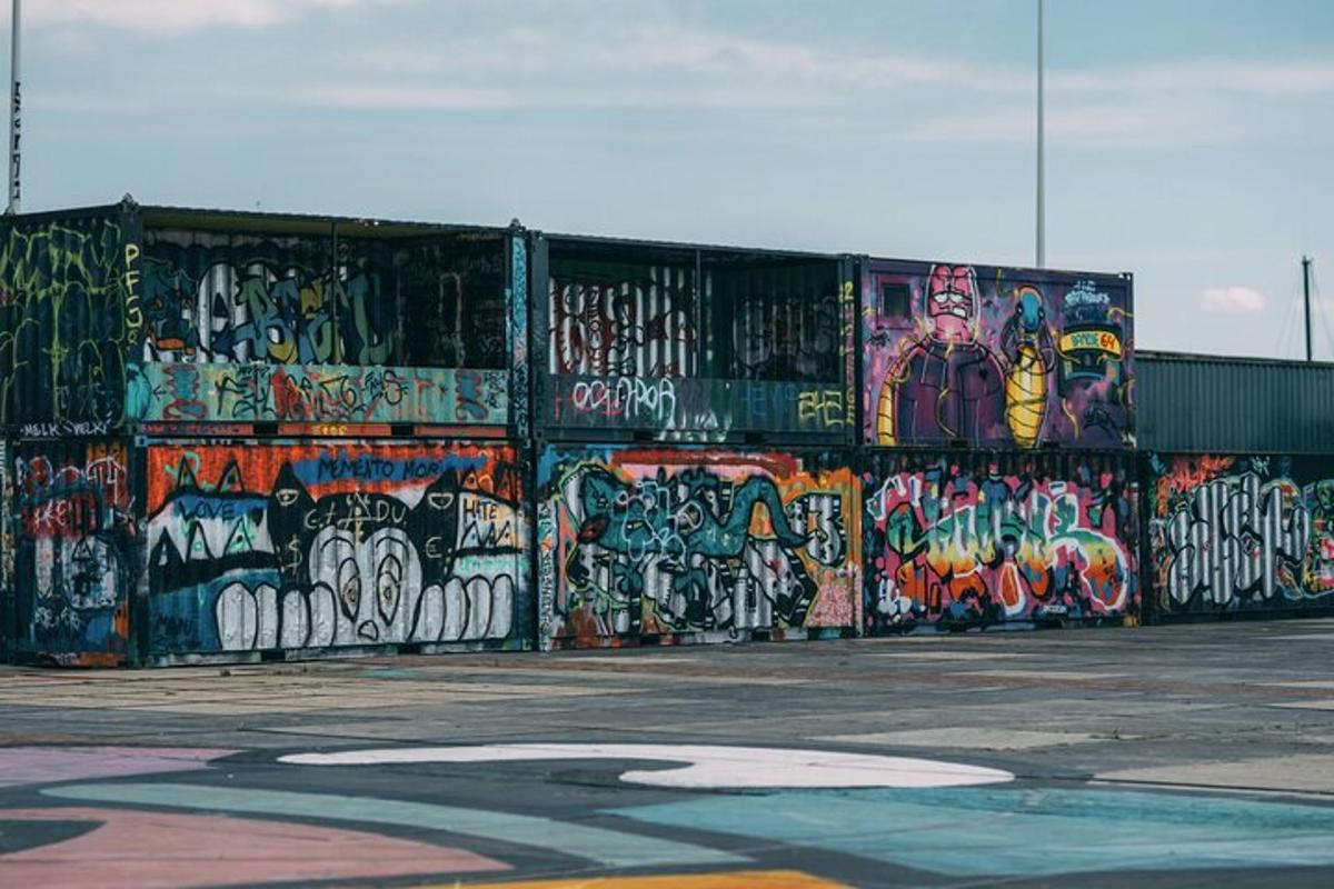 a wall covered ingraffiti with a lot of graffiti