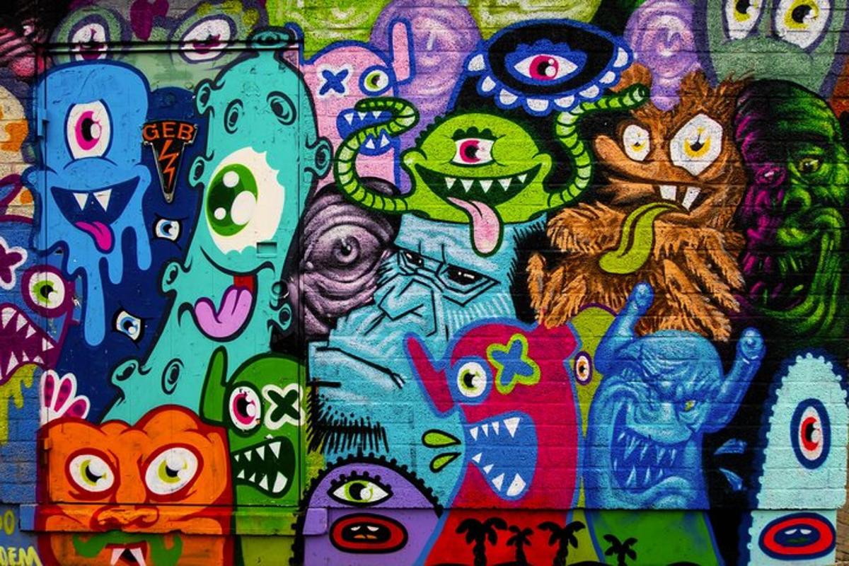 a wall with a bunch of graffiti on it