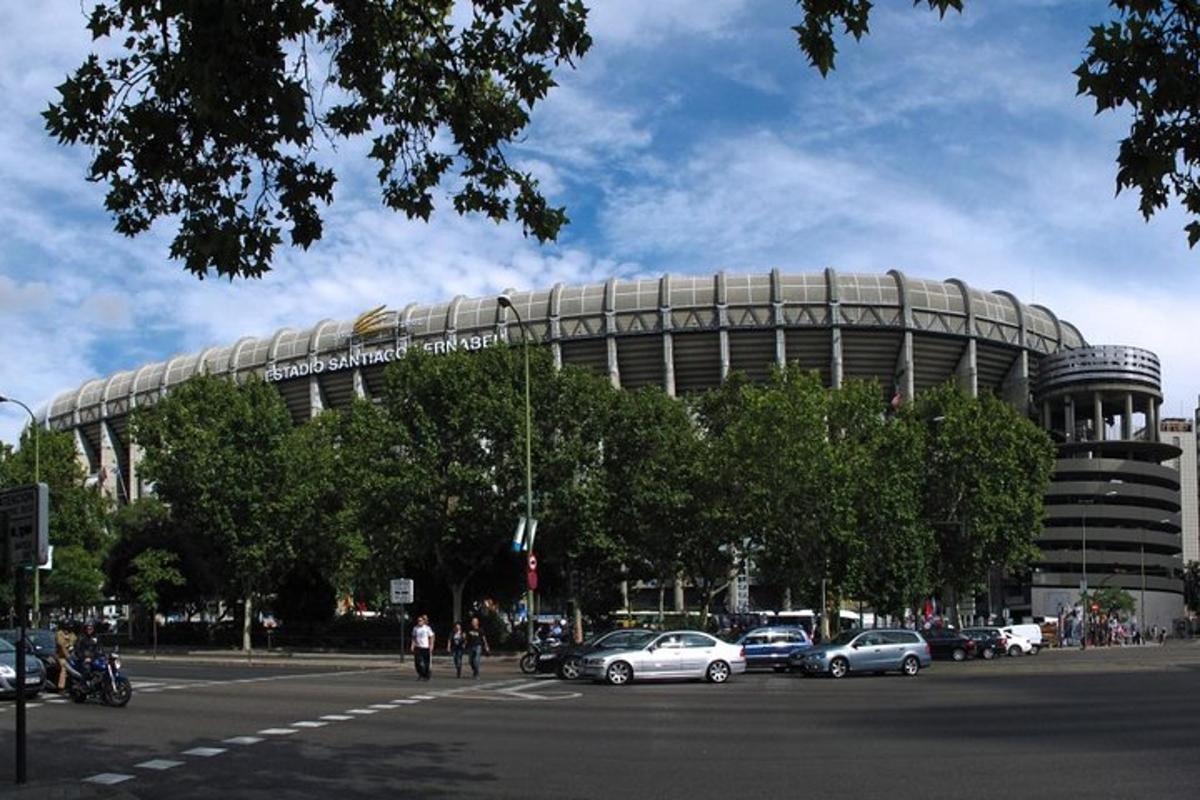 a large building with cars parked in front of it