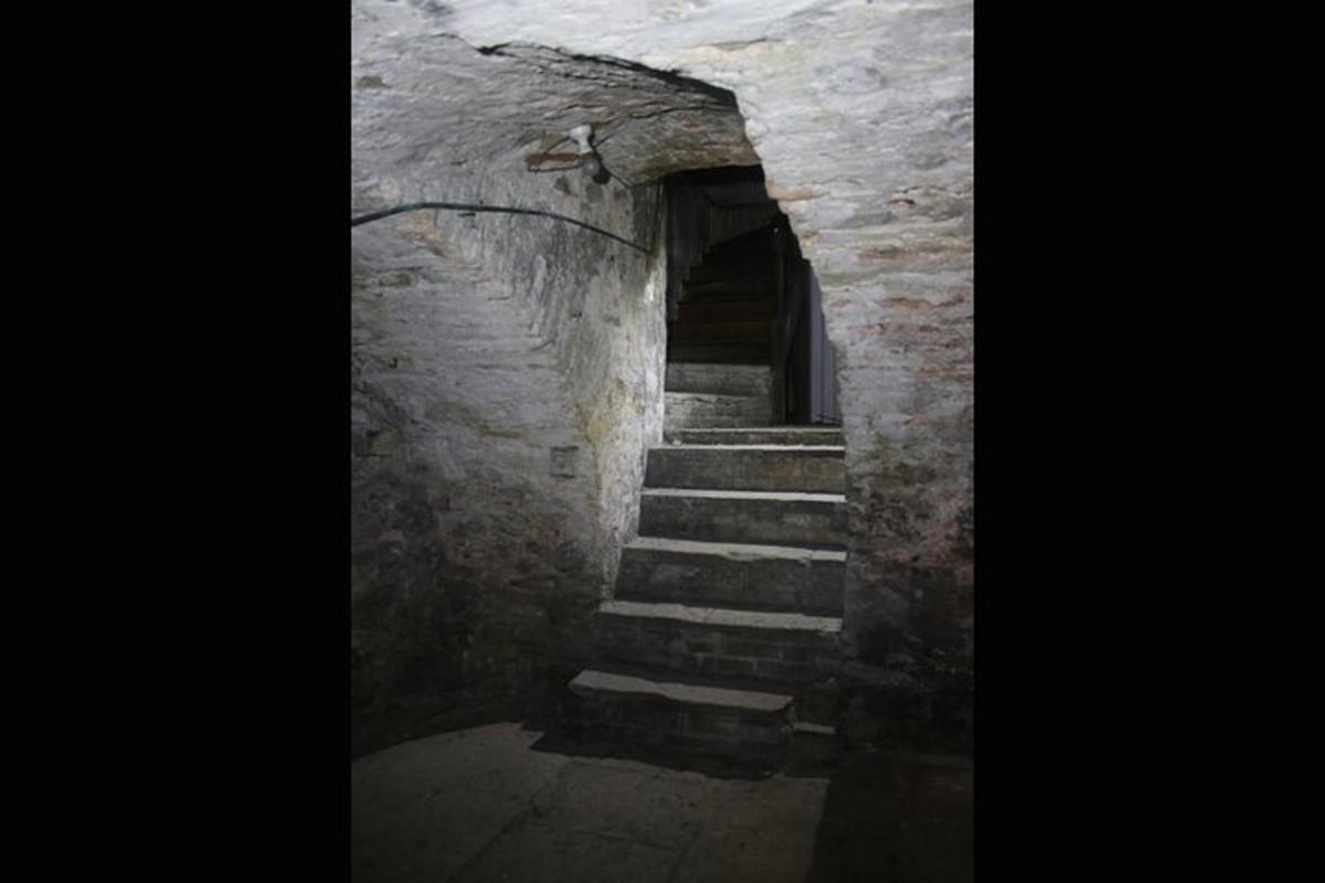a stone stairway with stairs leading to a doorway