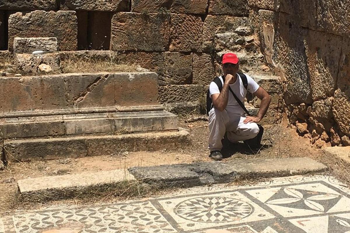 a man sitting on the steps of a building