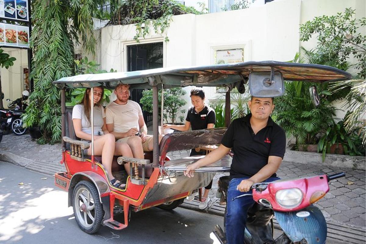 a group of people riding in a golf cart
