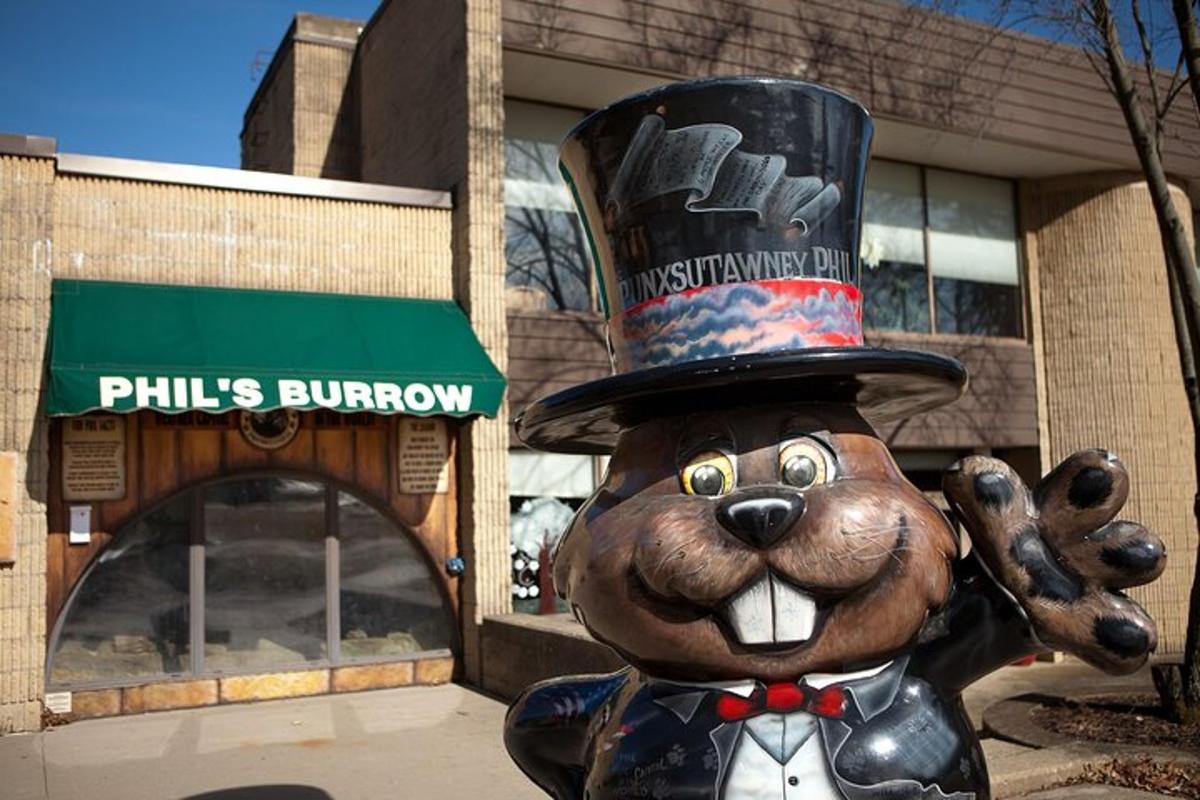 a statue of a bear wearing a top hat