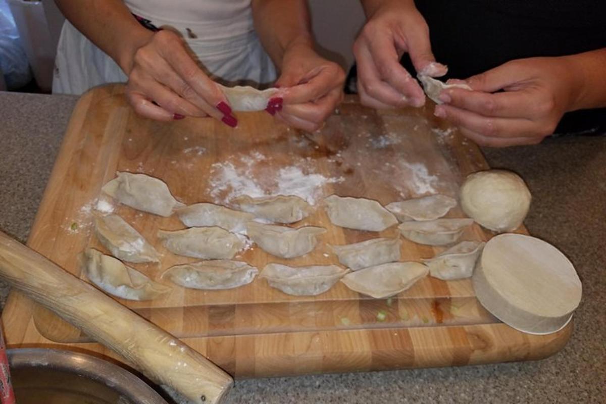 a person cutting up mushrooms on a cutting board