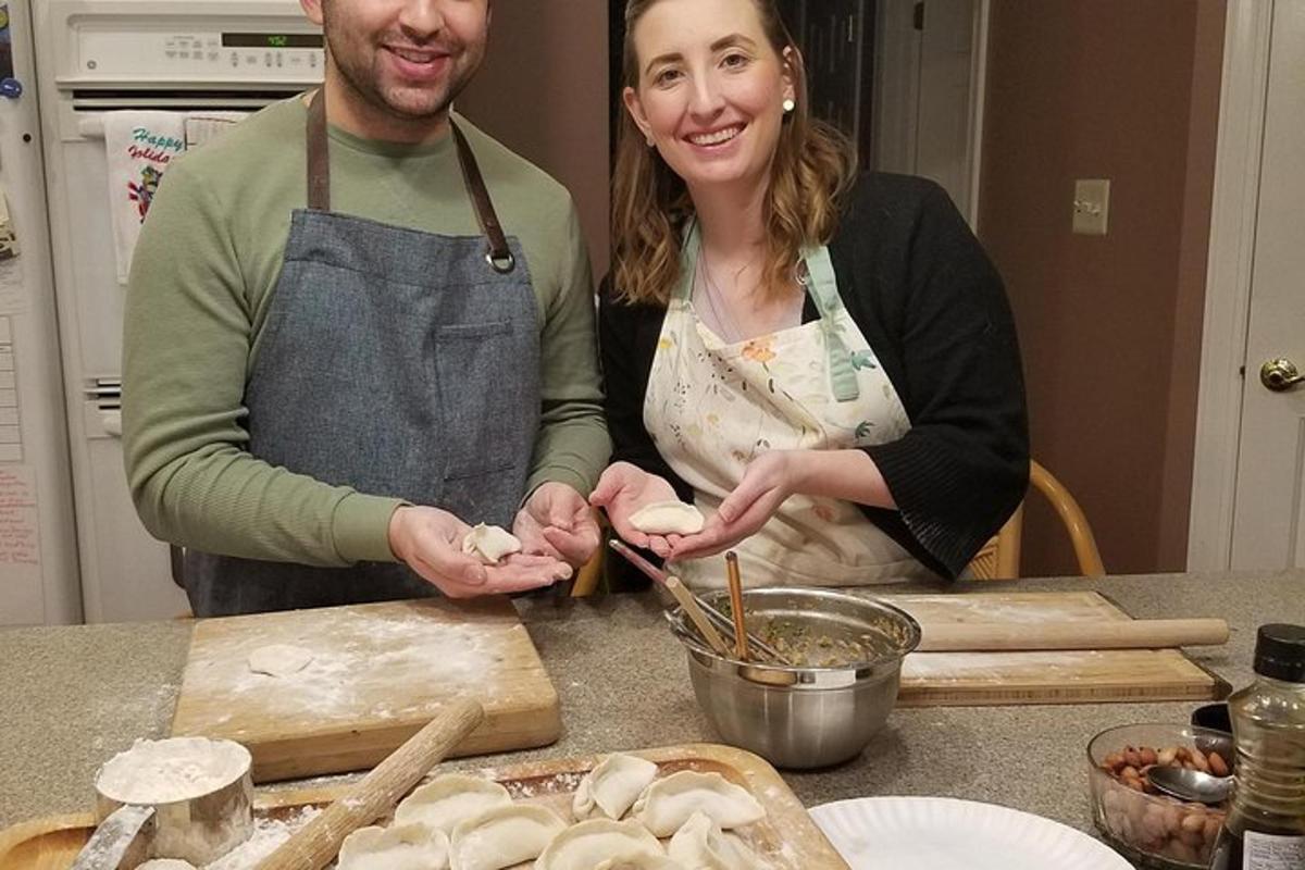a man and a woman standing in a kitchen preparing food