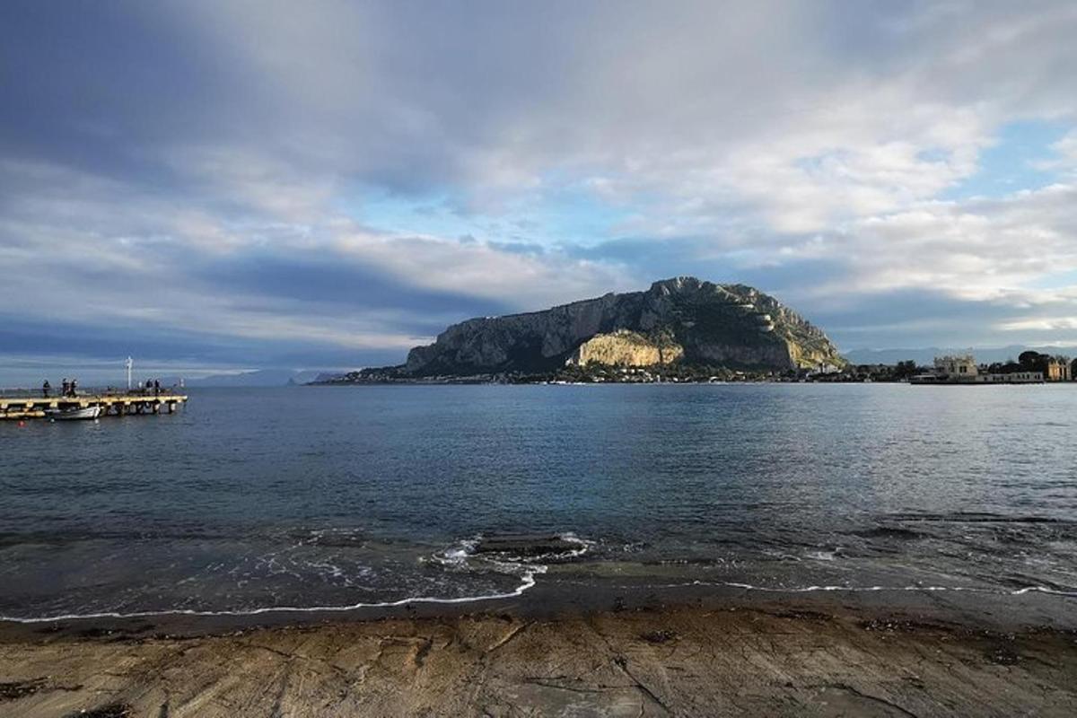 a mountain in the middle of a large body of water