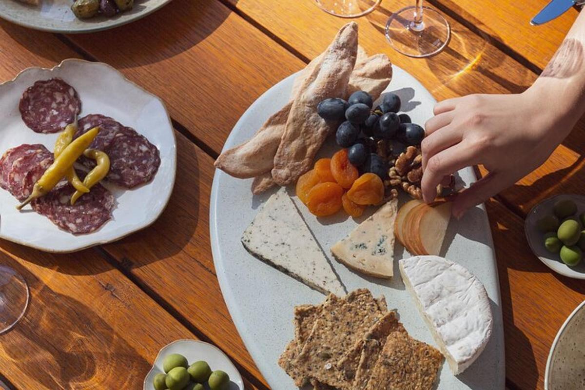 a wooden table with plates of food on it