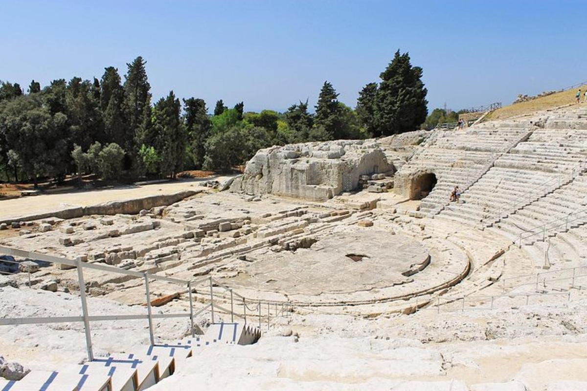 an amphitheatre in aniseum with trees in the background