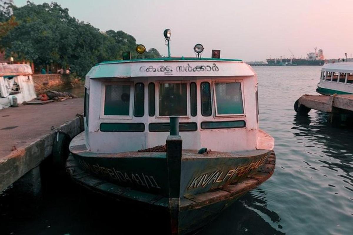 a boat sitting in the water next to a dock