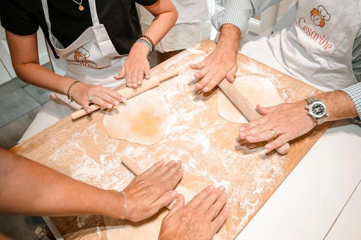 a group of people preparing food on a cutting board