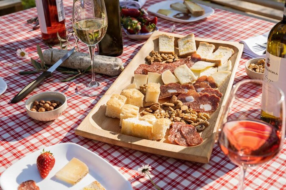 a table with a plate of food and a tray of cheese