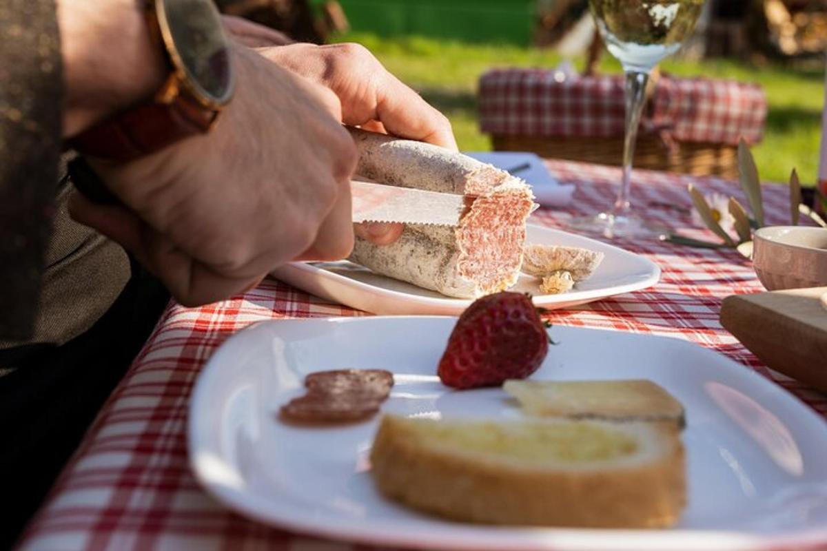 a person is cutting a piece of cake on a plate