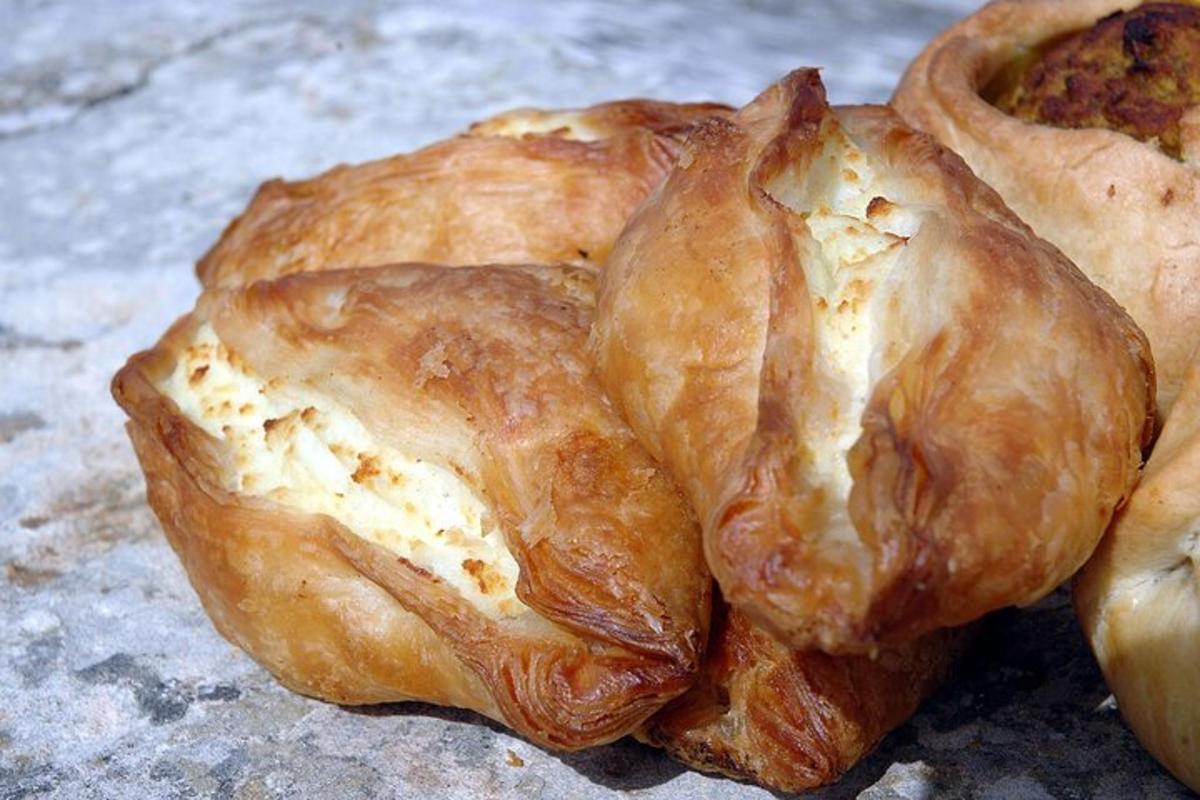 a close up of a puff pastry with a piece missing