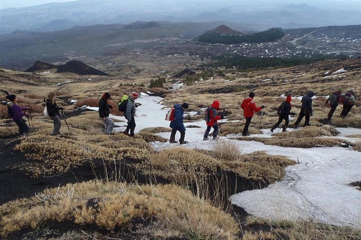 a group of people standing on top of a mountain
