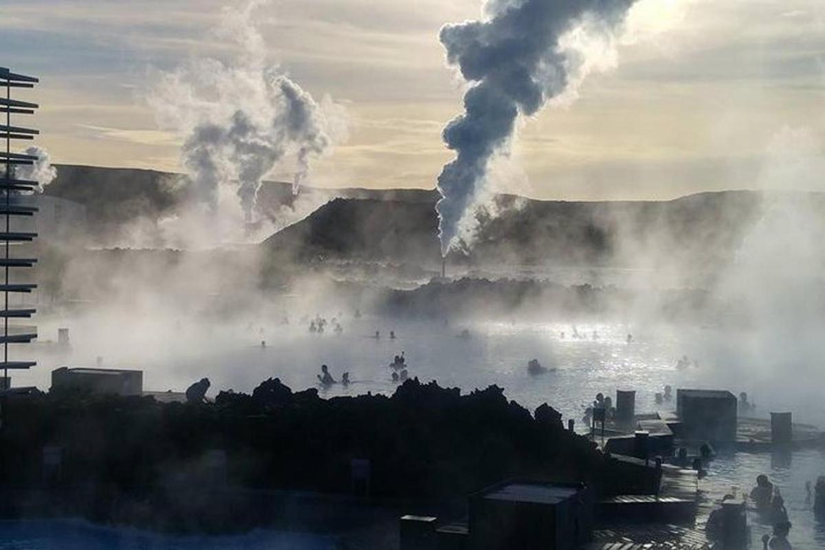 a view of a body of water with smoke and pollution