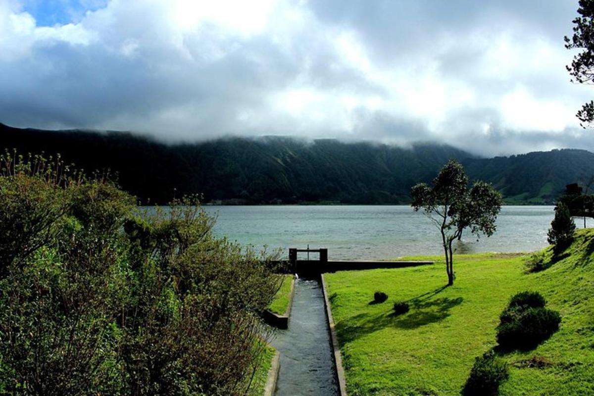 a bench sitting next to a body of water