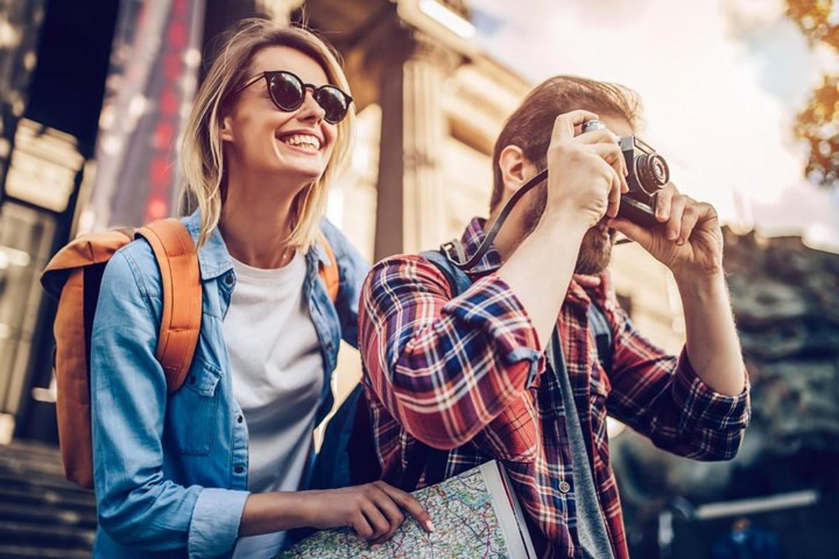 a man taking a picture of a woman with a camera