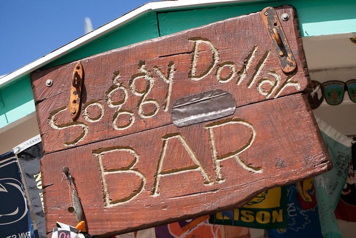 a wooden sign that says cowboy dolittle bar