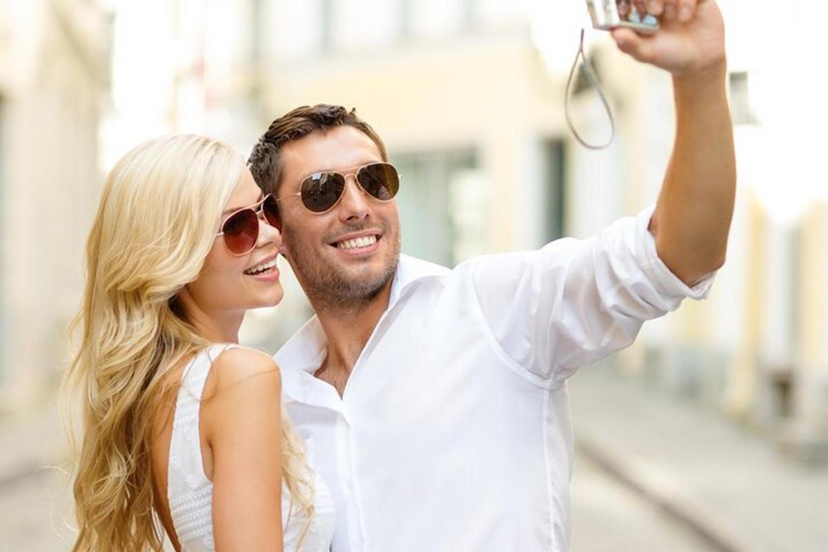 a man and woman taking a picture with a camera