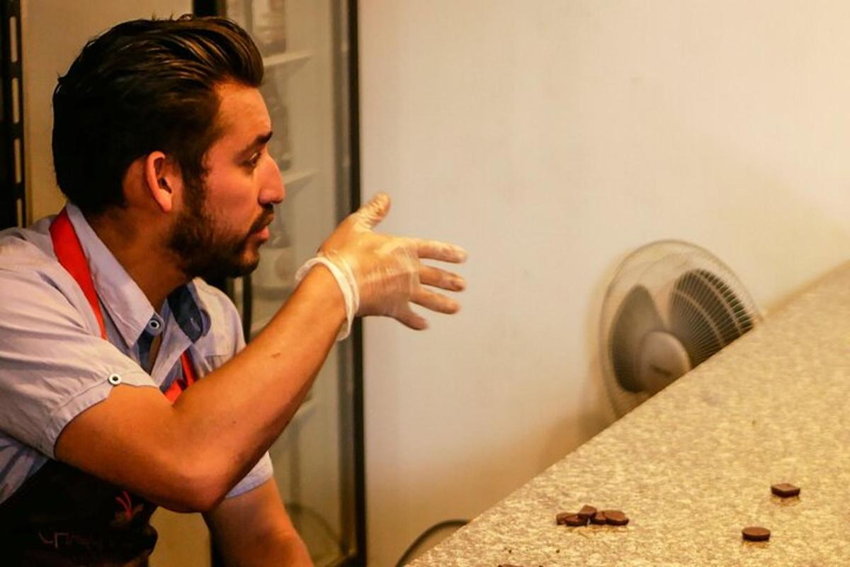 a man standing in front of a kitchen counter