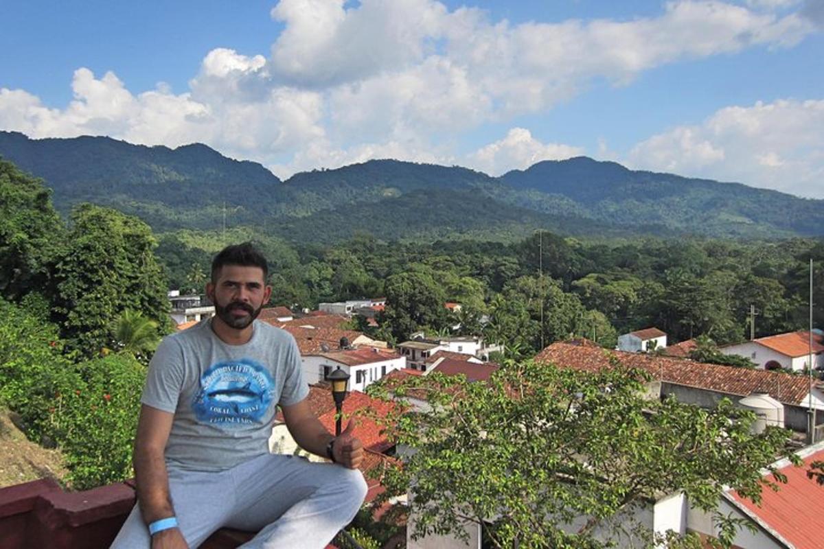 a man sitting on the edge of a roof