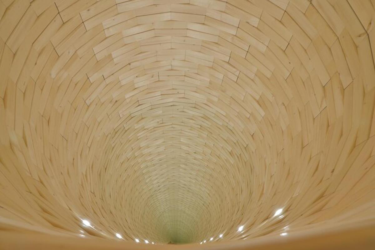 a ceiling with a circular design in a room