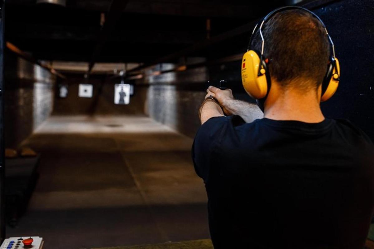 a man wearing headphones taking a picture of a tunnel
