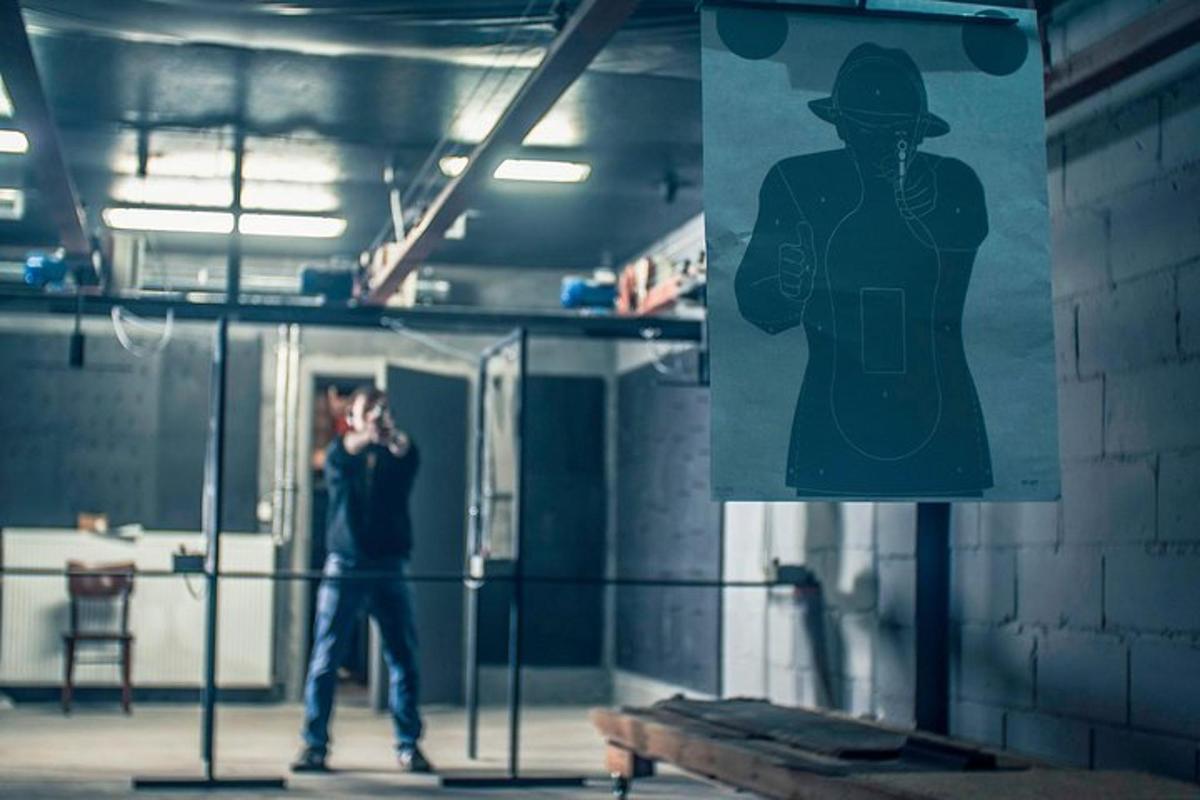 a man standing in front of a sign in a room