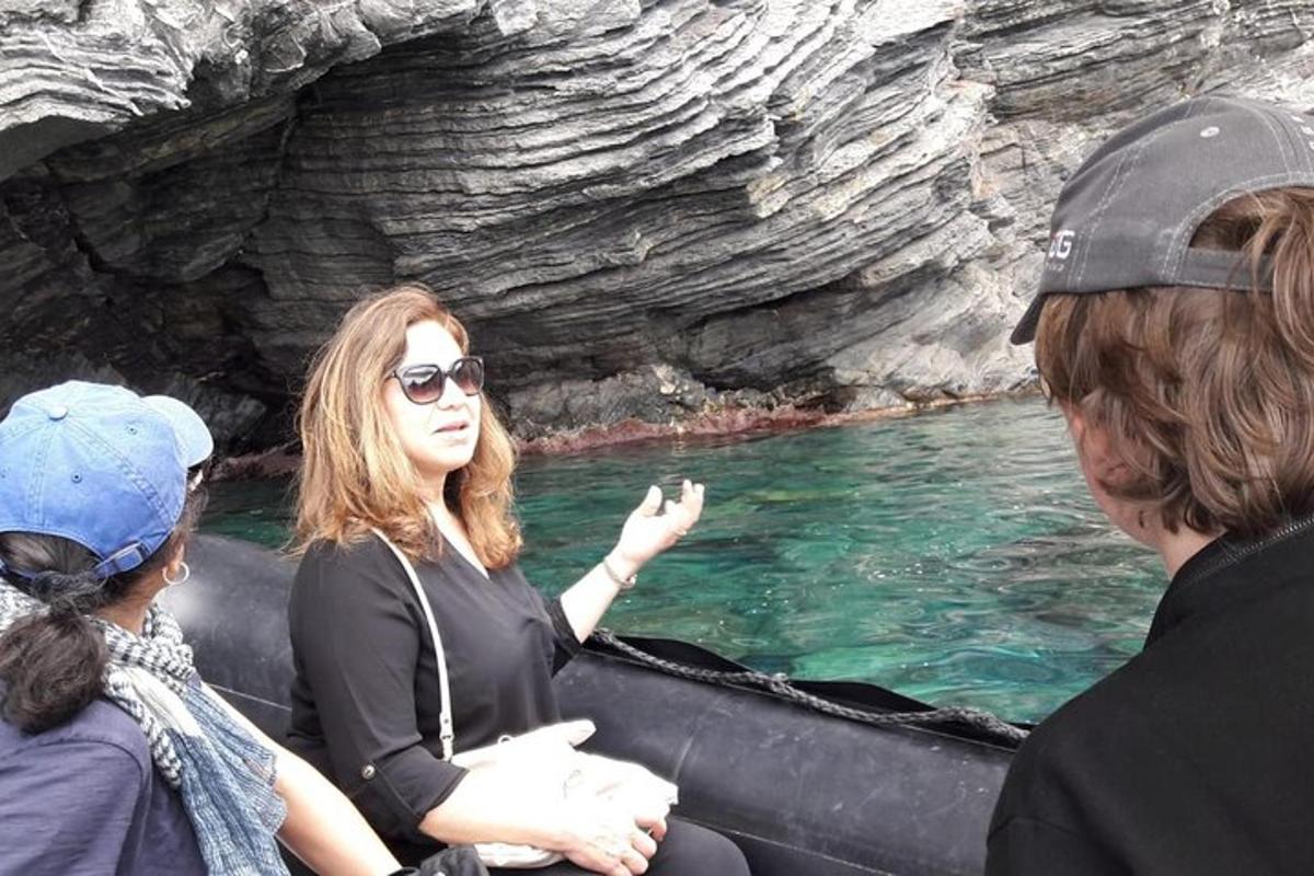 a group of people on a boat in the water