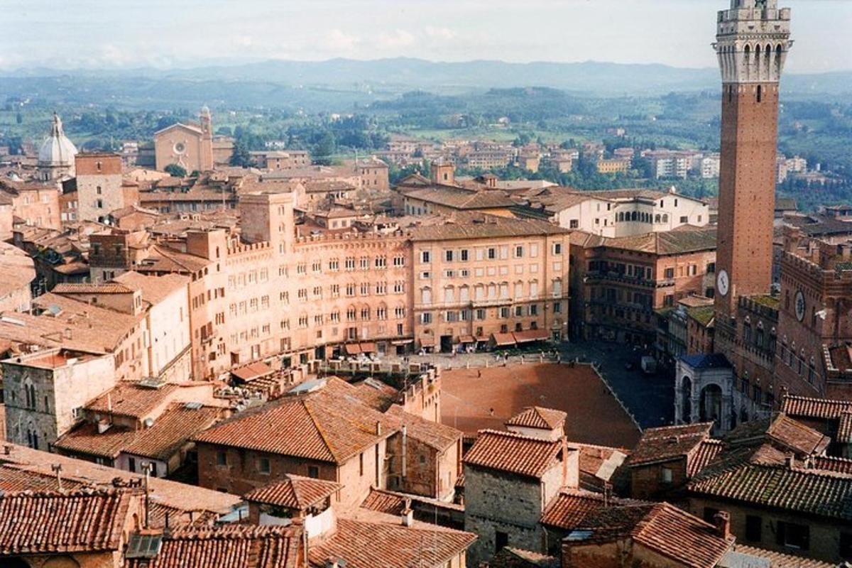 an aerial view of a city with a clock tower