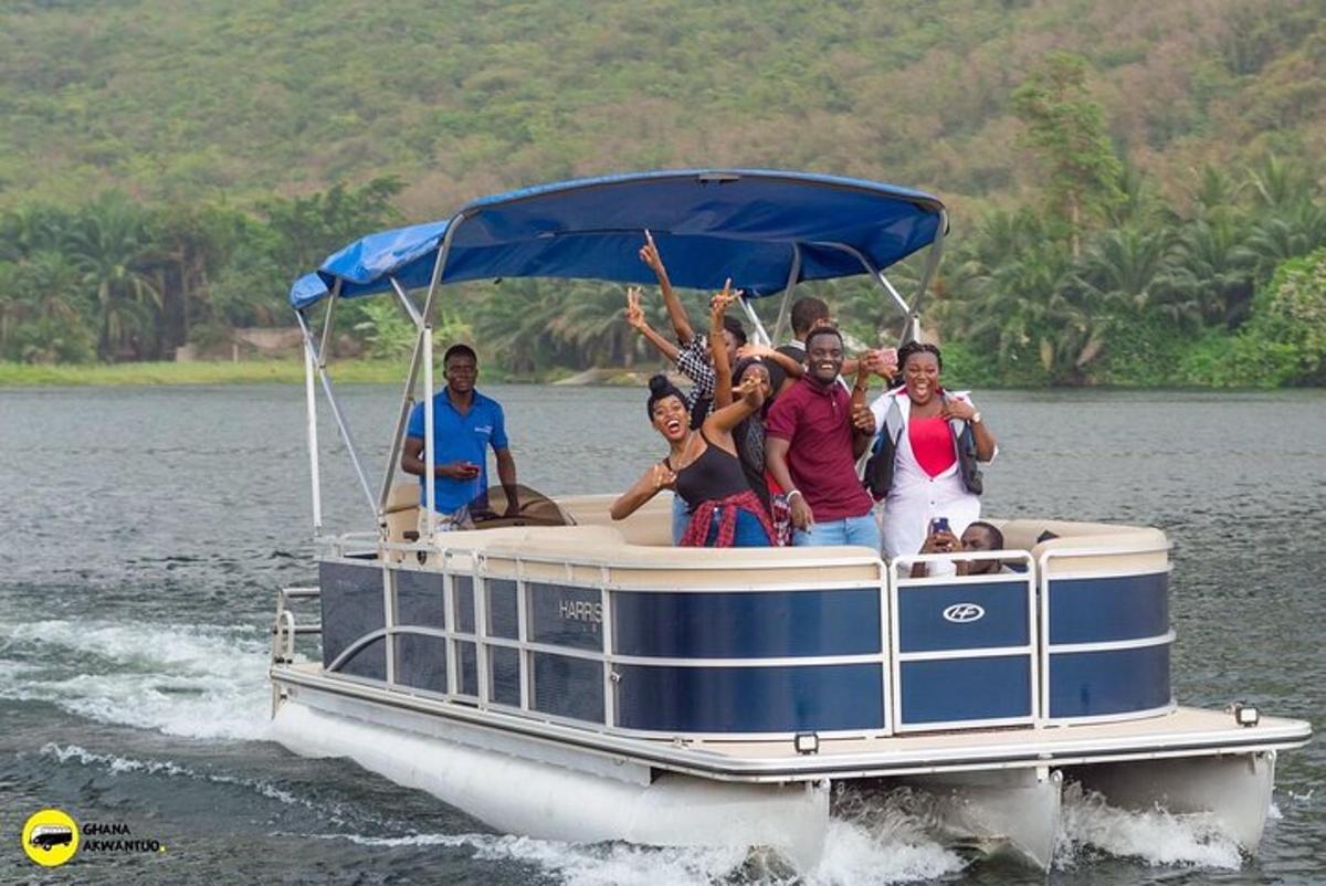 a group of people on a boat in the water