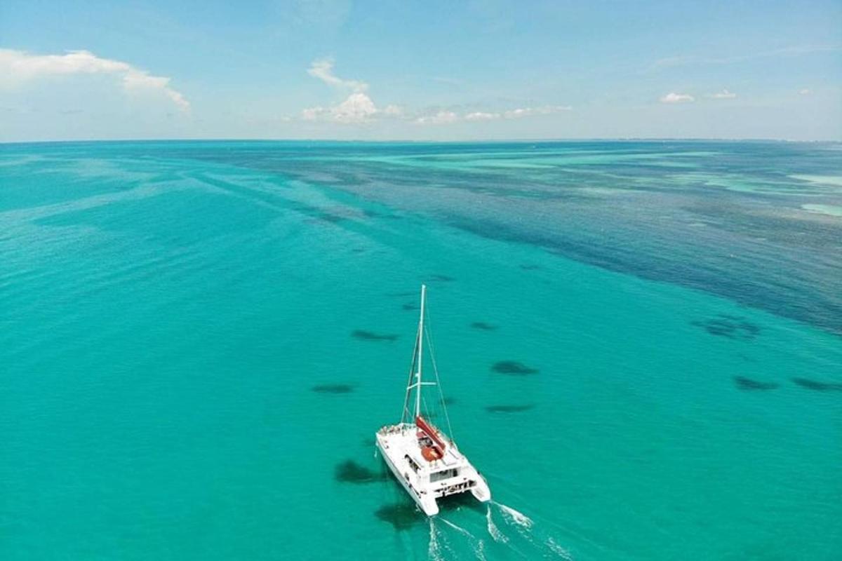a boat floating in the water in the ocean