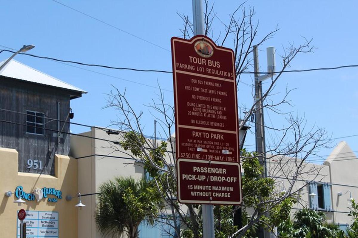 a group of signs on a pole on a street