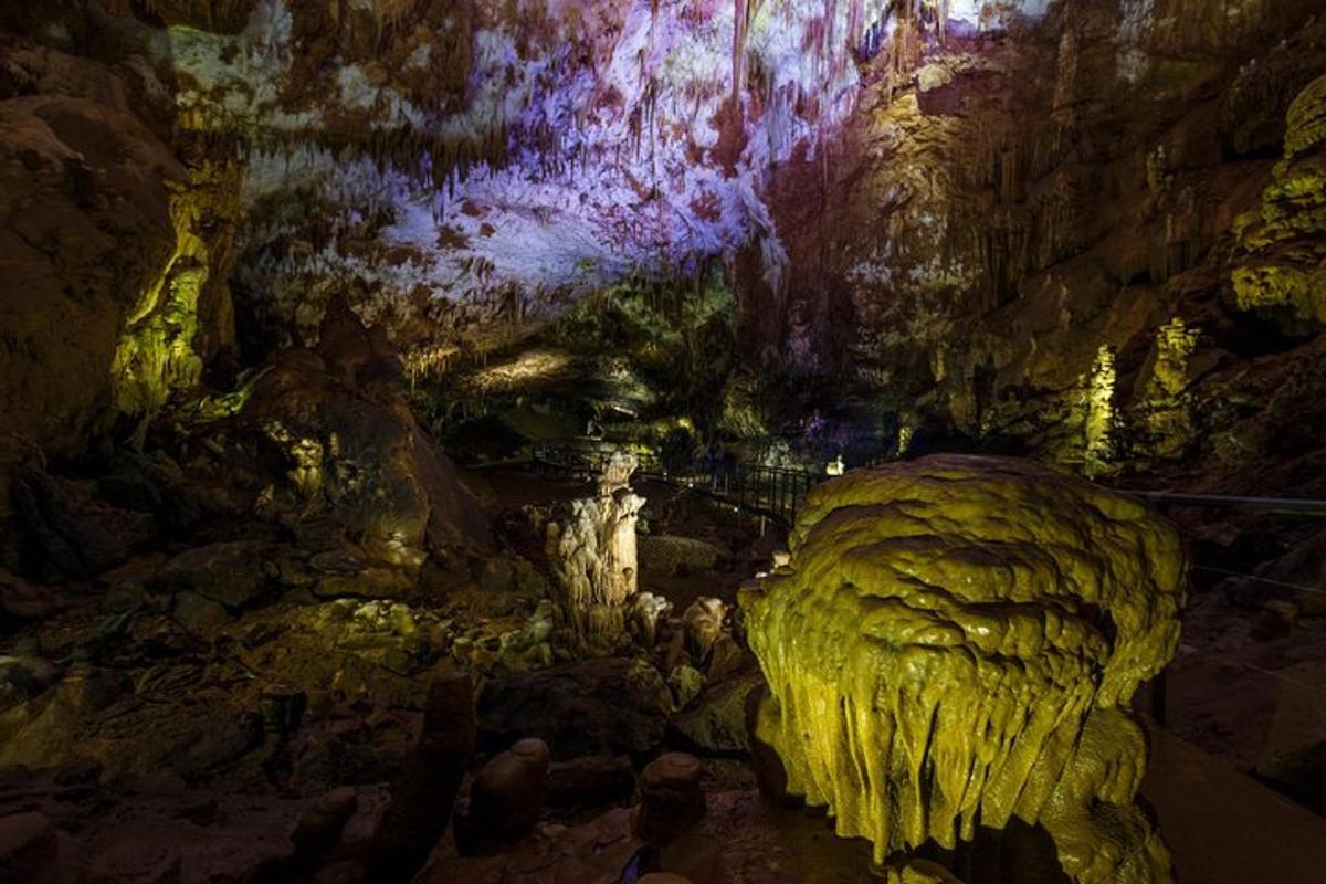 a cave with a statue in the middle of it