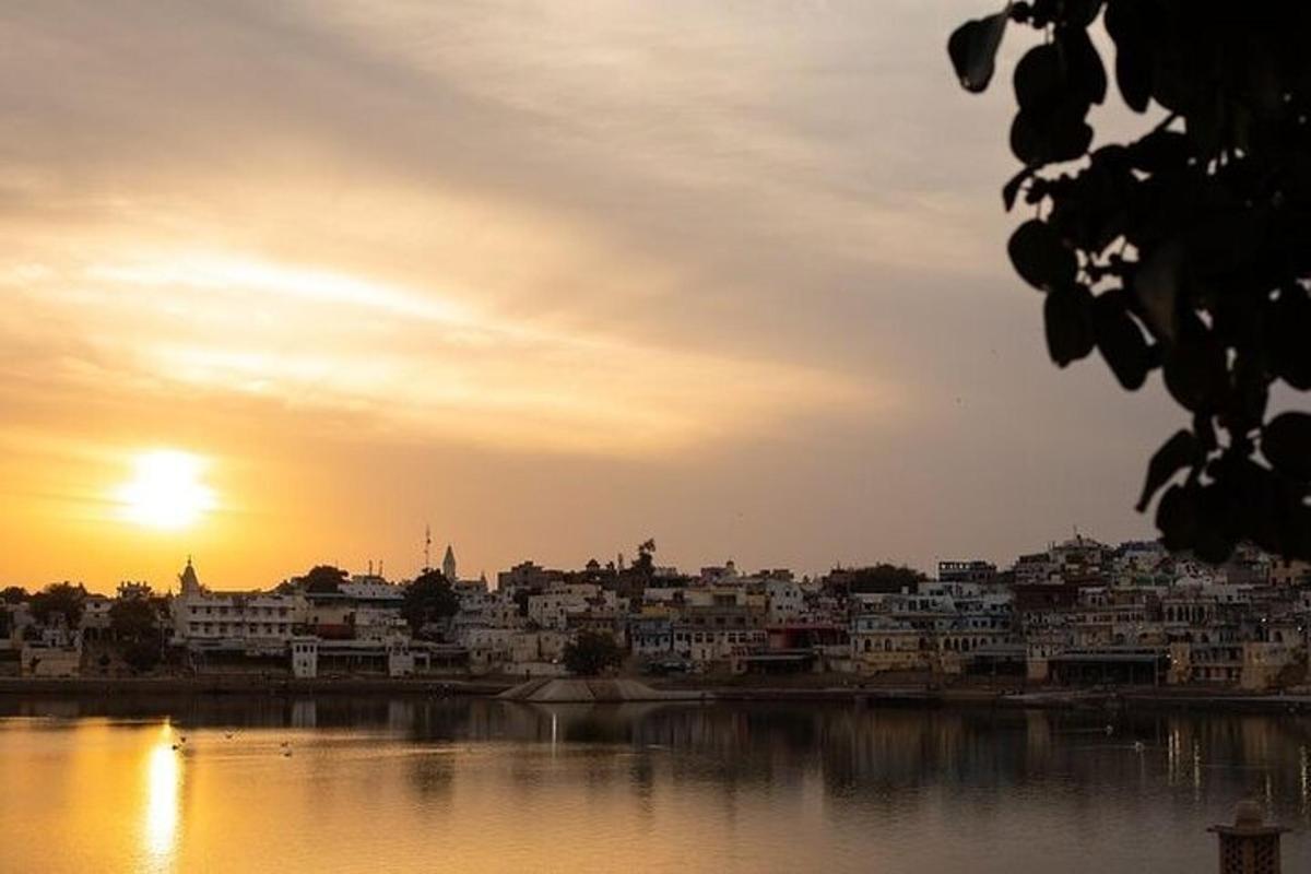 a view of a city with the sun setting