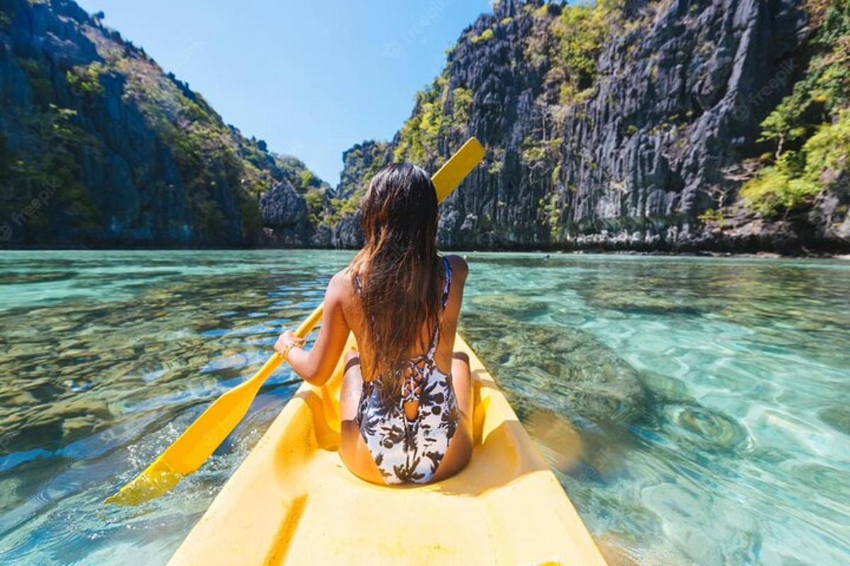 a woman sitting on a kayak in the water