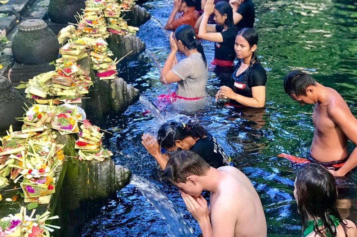 a group of people in the water with food