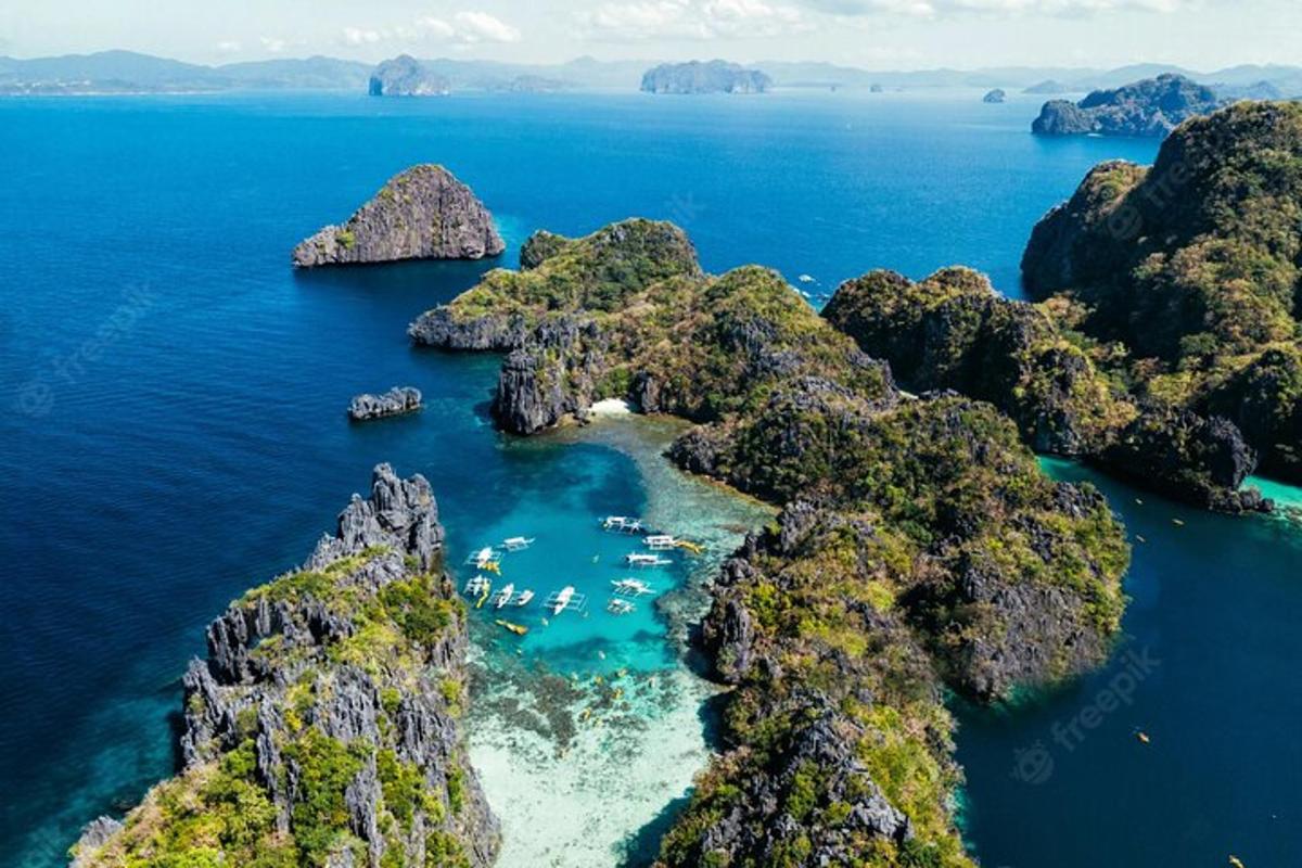 an aerial view of a rocky island in the ocean