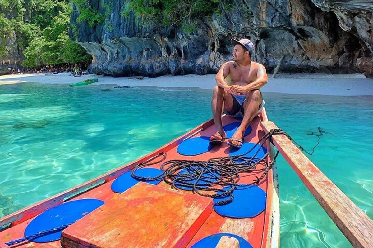 a man sitting on a boat in the water